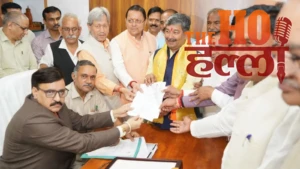 BJP प्रत्याशी दिनेश आर्य ने राज्यसभा के लिए भरा नामांकन, धामी की पूरी टीम रही साथ